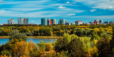 Obraz premium Residential neighborhoods of a Russian city. Residential areas with high-rise buildings in Kazan, Tatarstan. Houses on the banks of the river