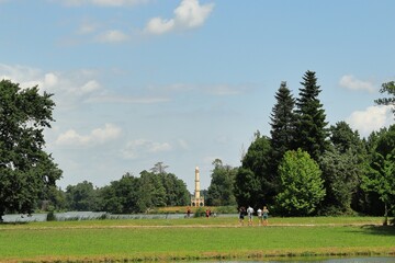 Lednice-Valtice area in the Czech Republic. Tourists are watching and taking pictures of the minaret. Inscribed on the UNESCO World Heritage List in 1996. Castle garden. Minimalist photography.