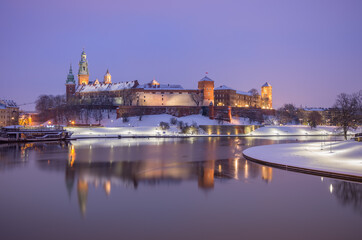 Krakow winter, night Wawel Castle over Vistula river, snow, Poland