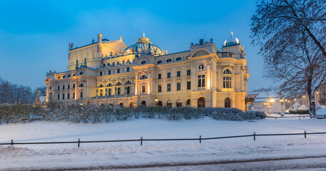 Fototapeta na wymiar Slowackiego Theater in Krakow, Poland, snowy winter night