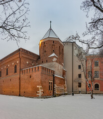 Krakow, Poland, medieval Ciesli tower and city arsenal in the winter morning