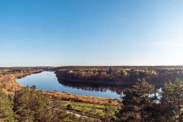 Landscape view on the bend of Daugava river from sightseeing tower located in Vasargeliski, Naujene parish, Daugavpils district, Latgale region, Latvia, which is a part of Nature Park “Daugavas Loki” - obrazy, fototapety, plakaty