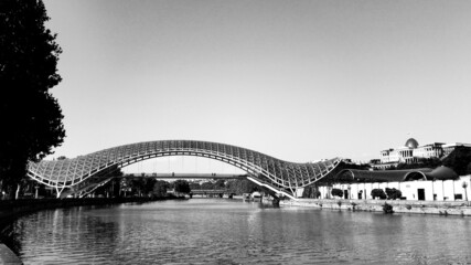 Pedestrian bridge over the Kura River in Tbilisi, Georgia. Black and white photo