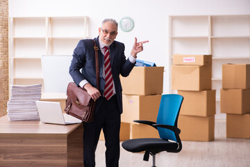 Old businessman employee in relocation concept