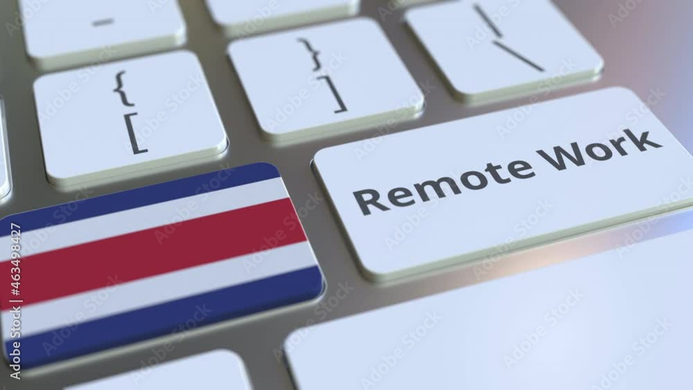 Poster remote work text and flag of costa rica on the computer keyboard. telecommuting or telework related 