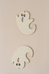 laser cut plywood ghost shapes on paper