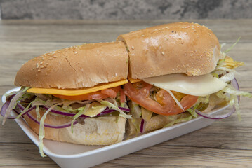 Handmade from fresh ingredients vegetarian sandwich with fresh chopped vegetables on Italian roll for a healthy diet