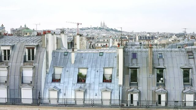 Aerial Paris. Montmartre hill, Parisian streets seen from above, panoramic view. Tourism attraction, famous landmark in France. Romantic honeymoon travel destination.