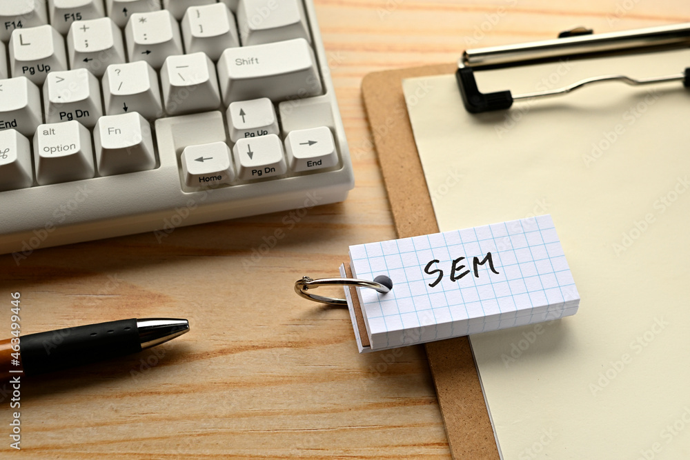 Poster there is a word book with the word of sem which is an abbreviation for search engine marketing on th