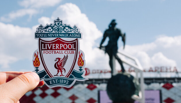June 14, 2021 Liverpool, UK. Liverpool F.C. Football Club emblem against the backdrop of a modern stadium.