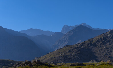 mountain sunset landscape with grass and clouds