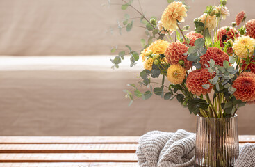 Bouquet of chrysanthemums in a vase in the interior of the room, copy space.