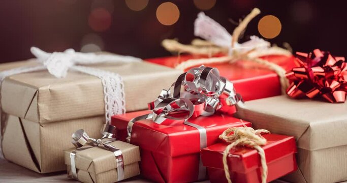 Animation of christmas presents over blurred background