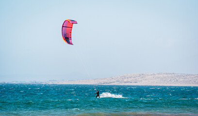 unknown person doing kitesurfing in Atacama, Chile © oscargutzo
