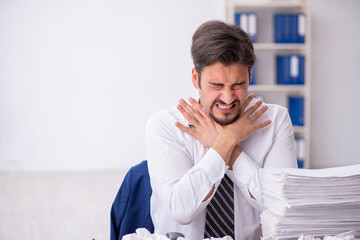 Young male employee in brainstorming concept