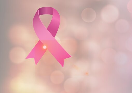Digitally generated image of pink ribbon icon against spots of light on pink background - Powered by Adobe