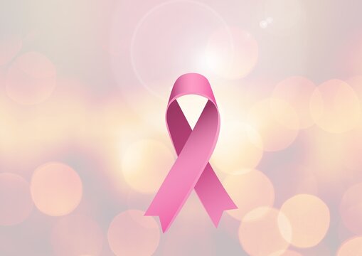 Digitally generated image of pink ribbon icon against spots of bokeh lights on pink background