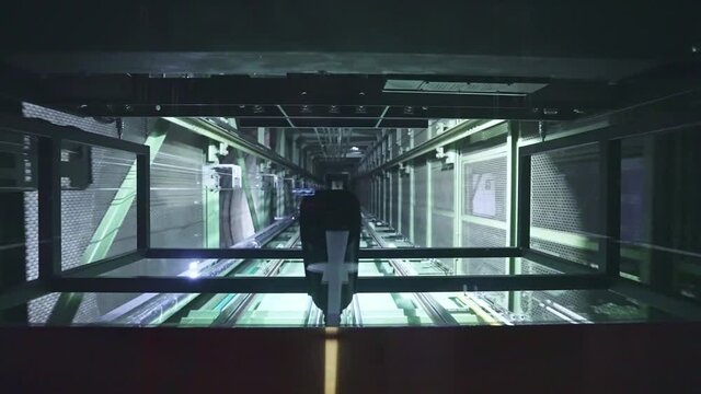 Elevator shaft, hoistway. High speed freight lift in modern industrial building. Futuristic tower interior corridor. 