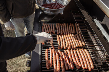 Close-up of cooking sausages on the grill.