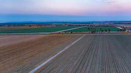 sun rise over ploughed field near Gin Gin, Queensland