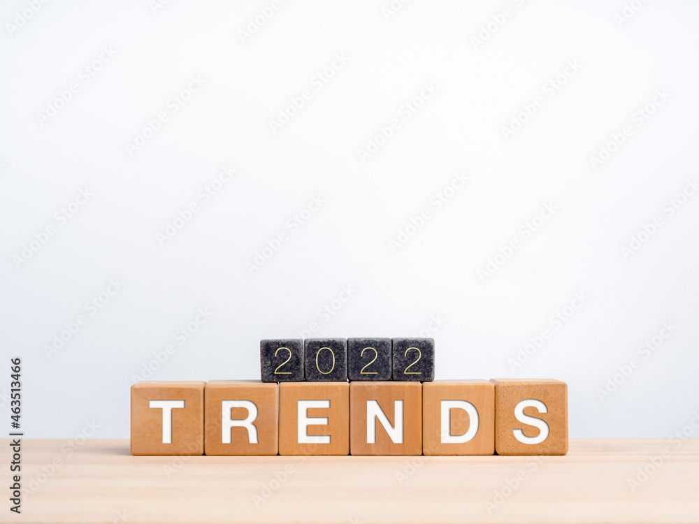 Aufkleber trends 2022 business background concept. the 2022 calendar year number on black dices on words, tren