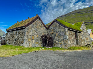 Fototapeta na wymiar Beautiful view of typical grass roof houses in Klaksvik in the Fareo Islands 