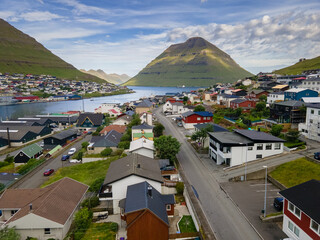 Beautiful aerial view of the City of Klaksvik in the Fareo Islands with its colorful houses and...