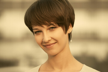 Happy young fashion woman with pixie hair style