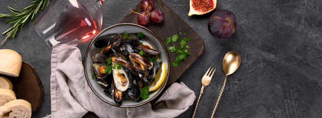 Mussels with snacks on dark background.