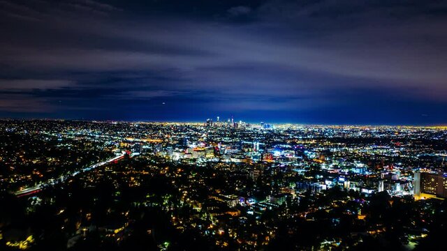 Hyperlapse drone shot of illuminated night cityscape of Los Angeles city - Aerial dronelapse view