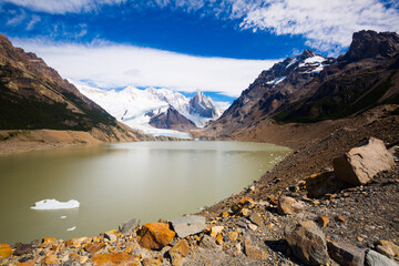View of lake and mountain peaks and glaciers of mountains Fitz Roy, Cerro Torre, Andes, Argentina
