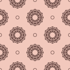 Pink vintage seamless texture with ornament. Design element. Decorative background. Exquisite floral wallpaper decor. Traditional decor on a pink background.