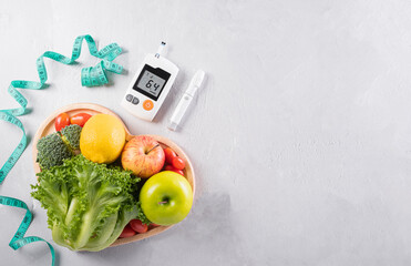 World diabetes day and healthcare concept. Diabetic measurement set, measure tape and healthy food...