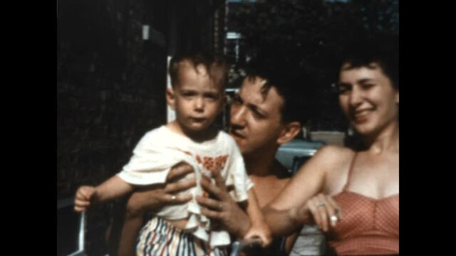 Proud of Baby Boy 1953 - Parents are proud of their young son.  