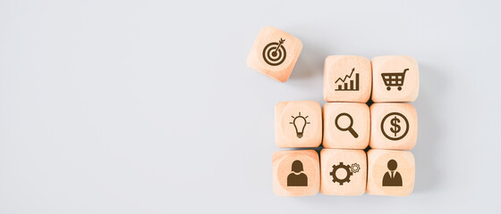 business icon on wooden cubes for business and finance background with copy space, top view