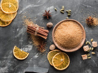 A set of spices for mulled wine. Cinnamon sticks, anise stars, nutmeg, brown sugar. Copy space.
