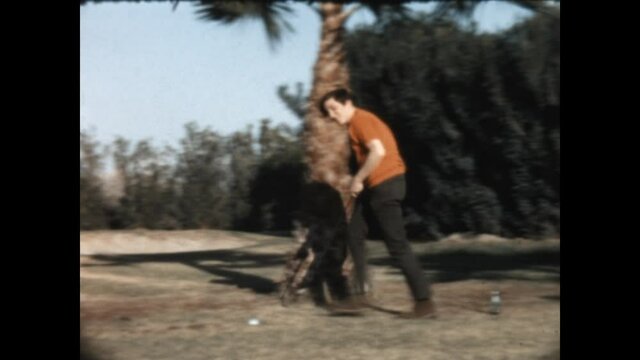 Teeing Off 1967 - A woman tees off and a man dances.  