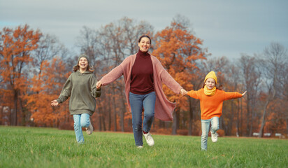 Fototapeta premium Happy family on autumn walk