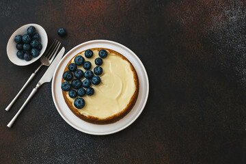 Classical New York cheesecake with blueberries. Homemade baking.