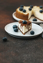Classical New York cheesecake with blueberries. Homemade baking. Piece of cheesecake.