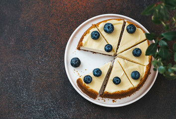 Classical New York cheesecake with blueberries. Homemade baking. Piece of cheesecake. Top view.