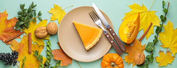 Autumn composition with tasty pumpkin pie on color background