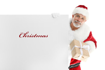 Santa Claus with gift and poster with word CHRISTMAS on white background