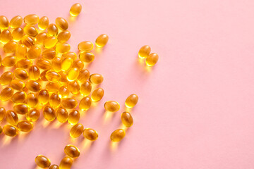 Vitamin A capsules on color background, closeup