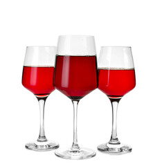 Glasses of delicious red wine on white background