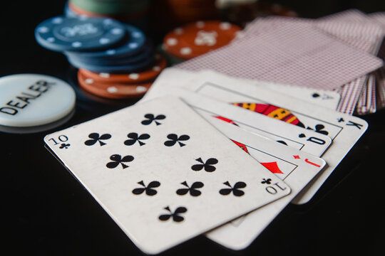 Playing cards for poker on dark background