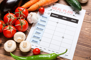 Meal plan and healthy products on wooden background