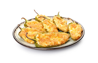 Plate with tasty jalapeno poppers on white background