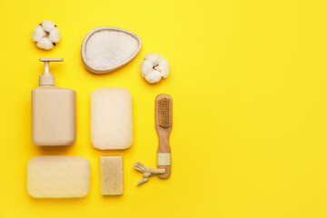 Bath supplies with sponges on color background