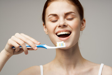 cheerful woman in white t-shirt dental hygiene health care isolated background